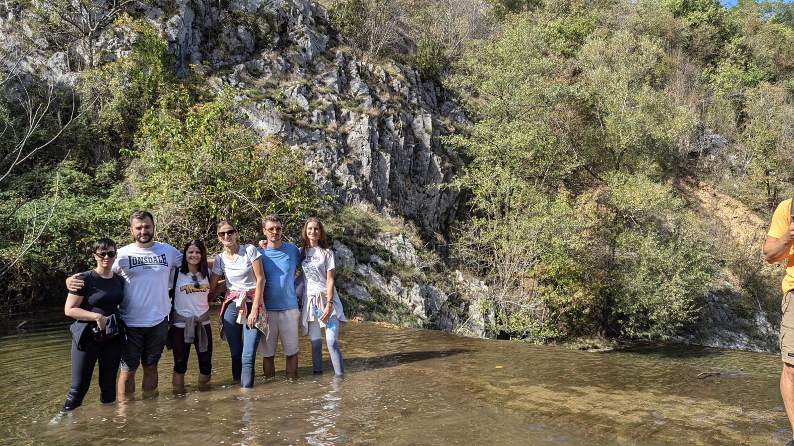 Hurricane Studio team hiking by a river canyon